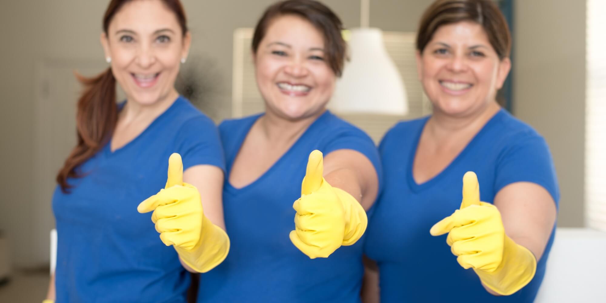 Happy cleaners giving thumbs up!